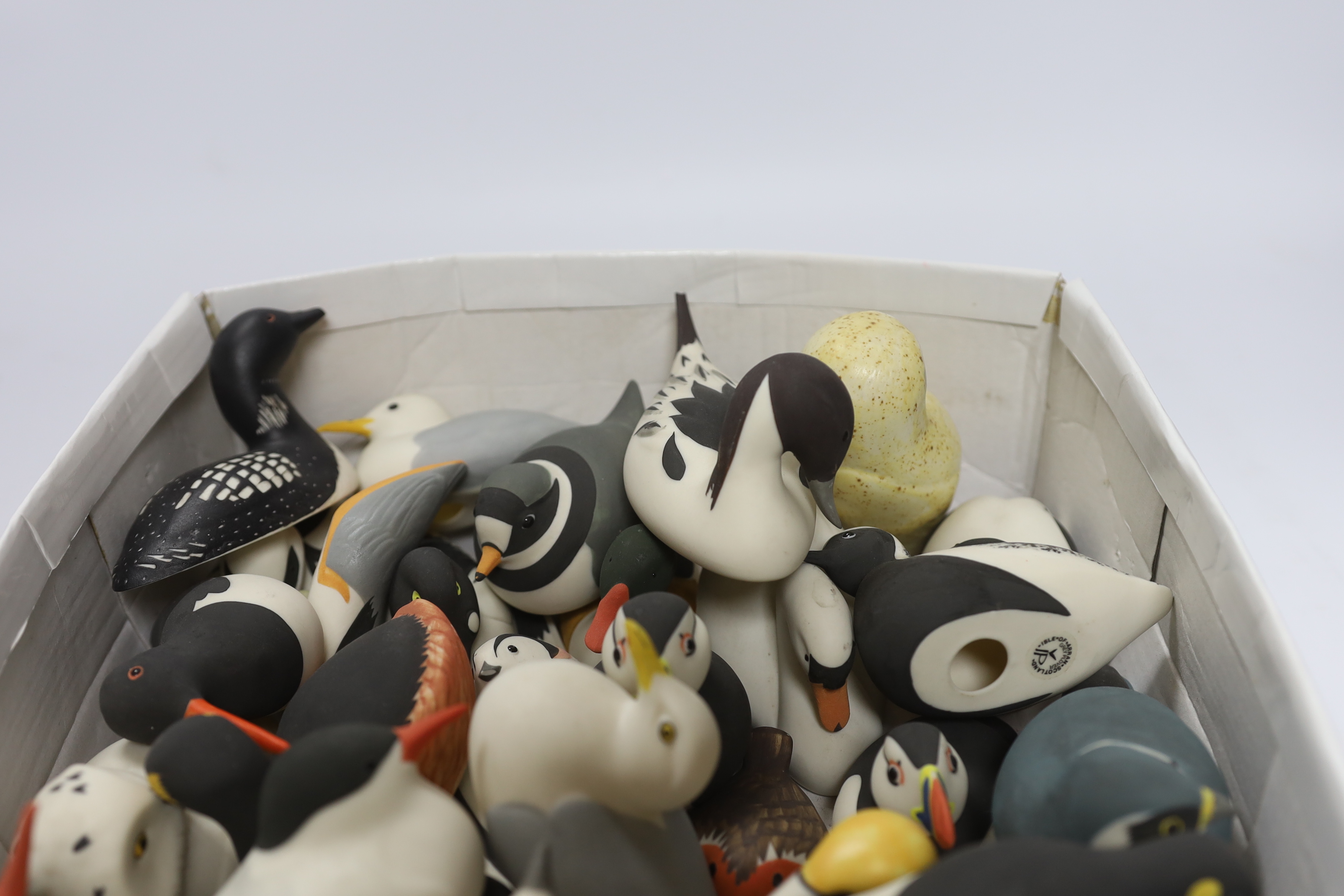 A collection of Isle of Arran ceramic birds